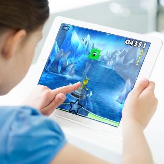 Child playing game on iPad