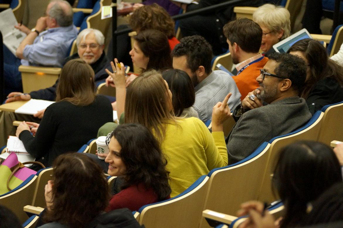 Audience members talking