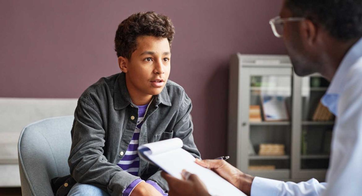 Young patient talking with a clinician