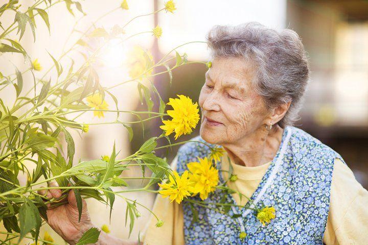 Woman smelling flowers