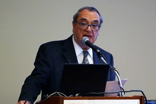 Course co-chair John Sikorski, MD, speaks to participants between presentations. 