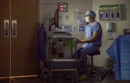 Hospital worker seated at desk