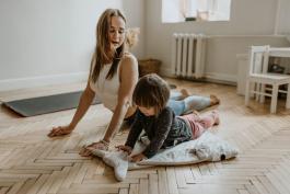 Woman and child doing yoga