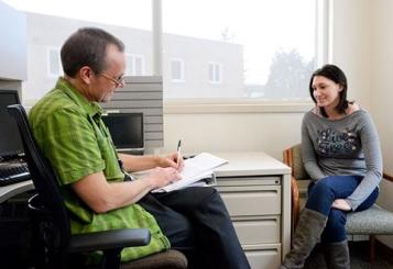 Woman talking to doctor
