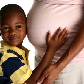 Young boy with pregnant mother